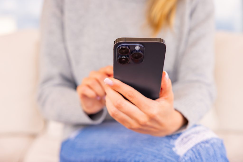 Woman using modern mobile phone